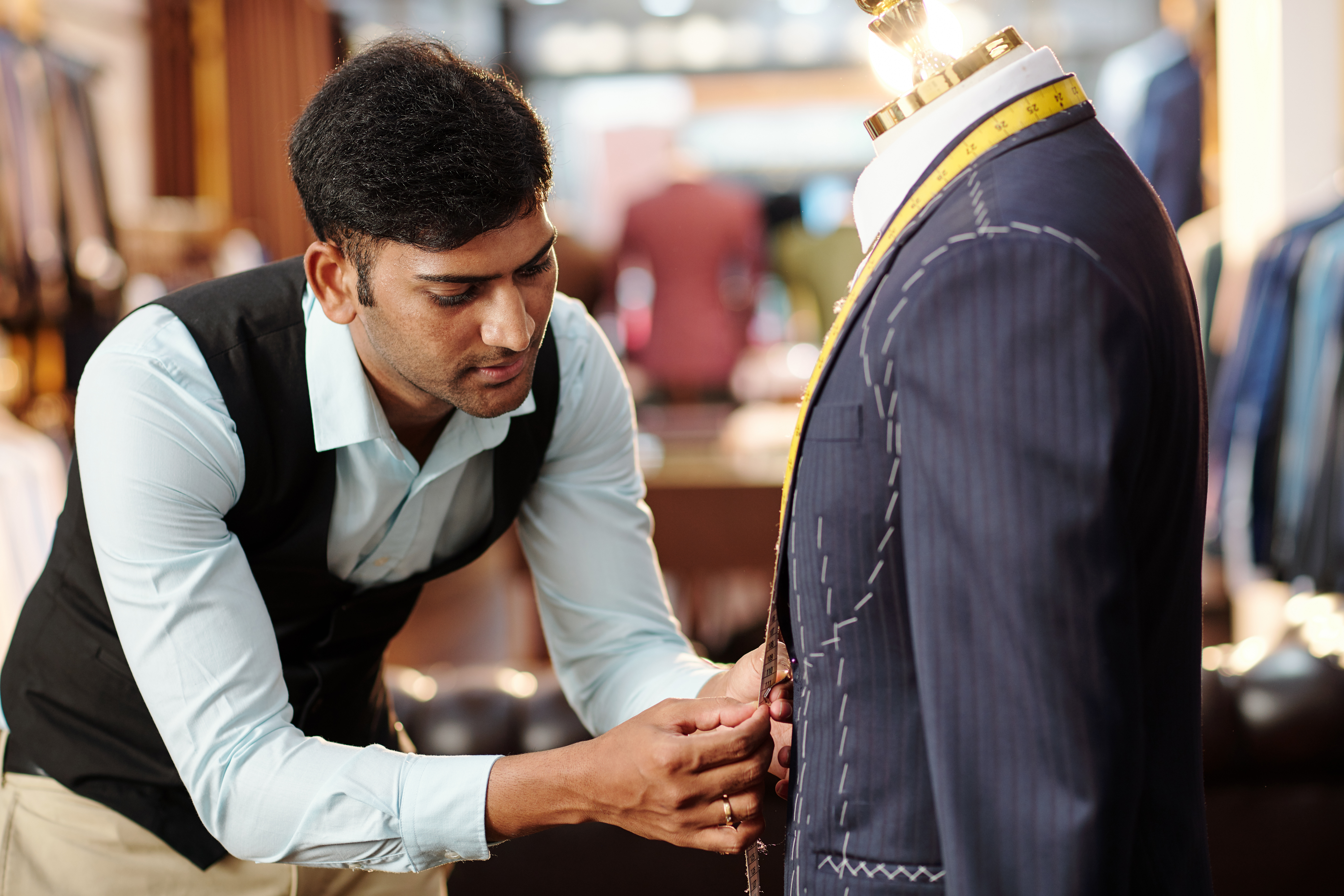 Tailor working on bespoke suit